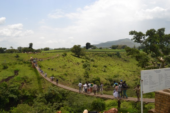 Children crossing the metal bridge