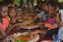 The children settle down to a varied lunch after their exciting trip.